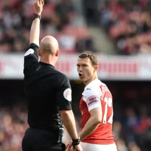 Arsenal's Stephan Lichtsteiner Shown Yellow Card by Referee Anthony Taylor vs. Brighton & Hove Albion