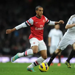 Arsenal's Theo Walcott Faces Off Against Swansea's Ben Davies in Premier League Clash (2012-13) Arsenal's Theo Walcott Faces Off Against Swansea's Ben Davies in Premier League Clash (2012-13)