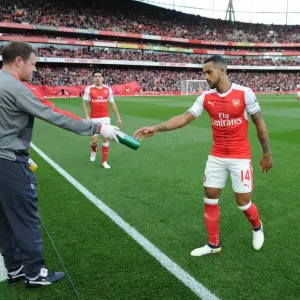 Arsenal's Theo Walcott Hydrates with Physio Colin Lewin Before Arsenal v Swansea City (2016-17)