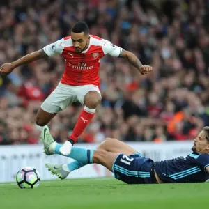 Arsenal's Theo Walcott Outmaneuvers Middlesbrough's Gaston Ramirez Arsenal's Theo Walcott Outmaneuvers Middlesbrough's Gaston Ramirez