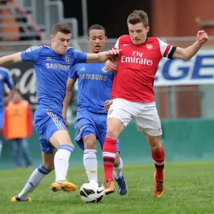 Arsenal's Thomas Eisfeld Tries to Outmaneuver Chelsea's Kevin Wright in NextGen Series Semi-Final