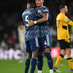 Arsenal's Thomas Partey and Ben White Celebrate Victory Over Wolverhampton Wanderers in Premier League
