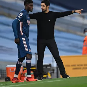 Arsenal's Thomas Partey Receives Tactical Instructions from Mikel Arteta during Manchester City Showdown (Premier League 2020-21)