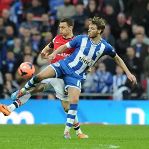 Arsenal's Thomas Vermaelen Faces Off Against Wigan's Nick Powell in FA Cup Semi-Final Showdown