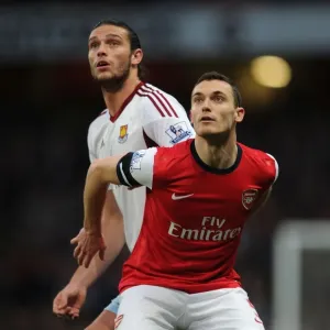 Arsenal's Thomas Vermaelen Holds Off Andy Carroll in Intense Arsenal v West Ham United Clash Arsenal's Thomas Vermaelen Holds Off Andy Carroll in Intense Arsenal v West Ham United Clash