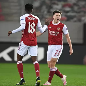 Arsenal's Tierney and Partey: Celebrating Goals in Europa League Victory over SL Benfica