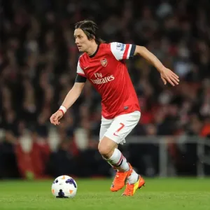 Arsenal's Tomas Rosicky in Action against West Ham United (2014) Arsenal's Tomas Rosicky in Action against West Ham United (2014)