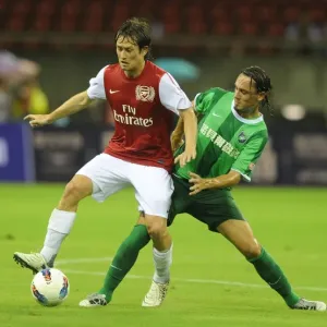 Arsenal's Tomas Rosicky Faces Off Against Vazquez in Hangzhou Friendly Arsenal's Tomas Rosicky Faces Off Against Vazquez in Hangzhou Friendly