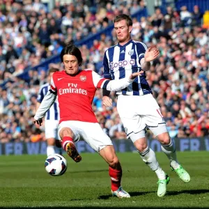 Arsenal's Tomas Rosicky Fends Off Chris Brunt's Pressure in Premier League Clash (West Bromwich Albion vs Arsenal, 2012-13) Arsenal's Tomas Rosicky Fends Off Chris Brunt's Pressure in Premier League Clash (West Bromwich Albion vs Arsenal, 2012-13)