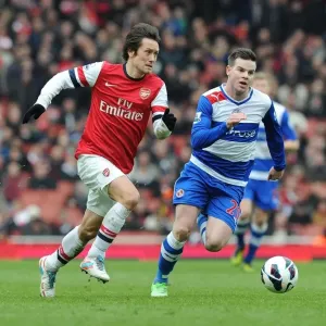 Arsenal's Tomas Rosicky Outmaneuvers Reading's Danny Guthrie during the Premier League Match