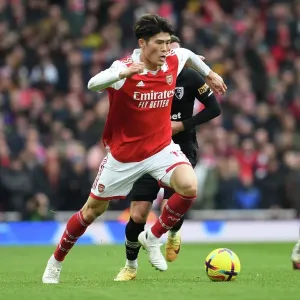 Arsenal's Tomiyasu in Action against AFC Bournemouth, Premier League 2022-23 Arsenal's Tomiyasu in Action against AFC Bournemouth, Premier League 2022-23