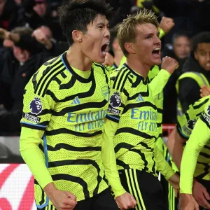 Arsenal's Tomiyasu and Odegaard Celebrate Goal Against Brentford in 2023-24 Premier League
