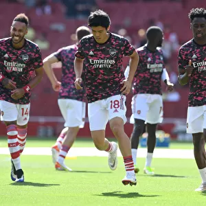 Arsenal's Tomiyasu Warming Up Ahead of Arsenal v Norwich City (2021-22)
