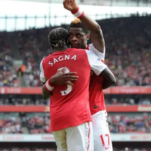 Arsenal's Triumph: Alex Song and Bacary Sagna's Celebration after 3-0 Win over Bolton Wanderers in the Premier League Arsenal's Triumph: Alex Song and Bacary Sagna's Celebration after 3-0 Win over Bolton Wanderers in the Premier League