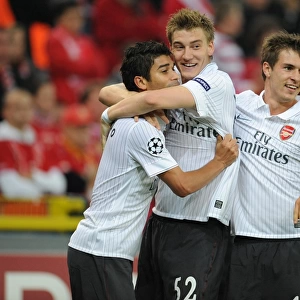 Arsenal's Triumph: Eduardo, Bendtner, and Ramsey Celebrate 3rd Goal vs Standard Liege (16/9/2009)