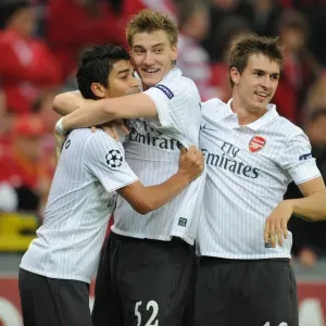 Arsenal's Triumph: Eduardo, Bendtner, and Ramsey Celebrate 3rd Goal vs Standard Liege (16/9/2009)