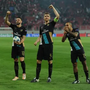 Arsenal's Triumph: Giroud, Mertesacker, and Walcott Celebrate Champions League Victory Arsenal's Triumph: Giroud, Mertesacker, and Walcott Celebrate Champions League Victory
