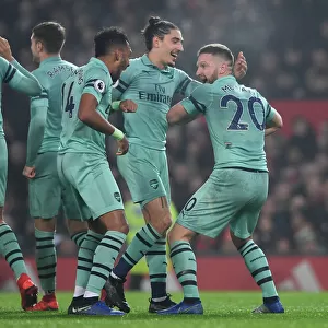 Arsenal's Triumph: Mustafi, Aubameyang, and Bellerin Celebrate First Goal vs. Manchester United (2018-19)
