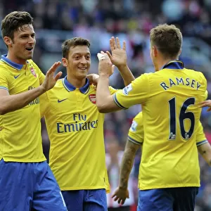 Arsenal's Triumph: Ramsey, Giroud, Ozil Celebrate Goals Against Sunderland (2013-14)