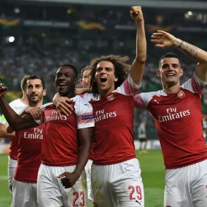 Arsenal's Triumph: Welbeck, Guendouzi, and Xhaka Celebrate Goal against Sporting Lisbon (2018-19) Arsenal's Triumph: Welbeck, Guendouzi, and Xhaka Celebrate Goal against Sporting Lisbon (2018-19)