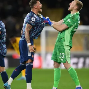 Arsenal's Triumphant Moment: Ben White and Aaron Ramsdale Celebrate Victory over Wolverhampton Wanderers in Premier League 2021-22
