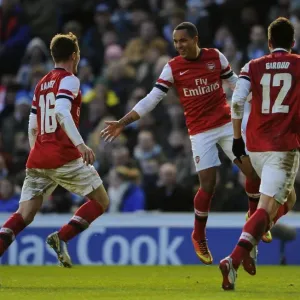Arsenal's Triumphant Threesome: Walcott, Ramsey, and Giroud Celebrate FA Cup Goals against Brighton
