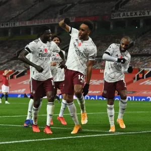 Arsenal's Triumphant Trio: Aubameyang, Partey, Lacazette - Celebrating a Goal at Manchester United (2020-21) Arsenal's Triumphant Trio: Aubameyang, Partey, Lacazette - Celebrating a Goal at Manchester United (2020-21)