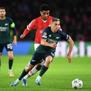 Arsenal's Trossard Clashes with PSV's Tillman in Champions League Battle Arsenal's Trossard Clashes with PSV's Tillman in Champions League Battle