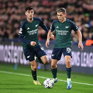 Arsenal's Trossard Dashes Through PSV Eindhoven's Defense in 2023-24 UEFA Champions League Clash