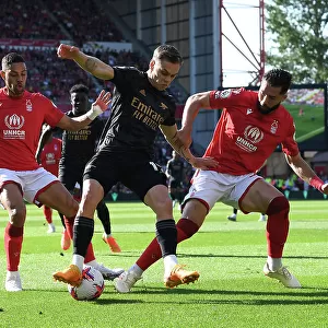 Arsenal's Trossard Faces Off Against Forest's Defense in Premier League Clash
