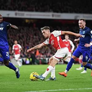 Arsenal's Trossard Faces Off Against Ogbonna in Intense Premier League Clash (2023-24)