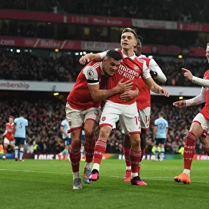 Arsenal's Trossard, Xhaka, and Zinchenko Celebrate Goal Against Brentford in Premier League
