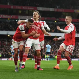 Arsenal's Trossard, Xhaka, and Zinchenko Celebrate Goal Against Brentford in Premier League Arsenal's Trossard, Xhaka, and Zinchenko Celebrate Goal Against Brentford in Premier League