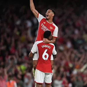 Arsenal's Unbeatable Duo: Saliba and Magalhaes Celebrate Victory Over Manchester City (2023-24)