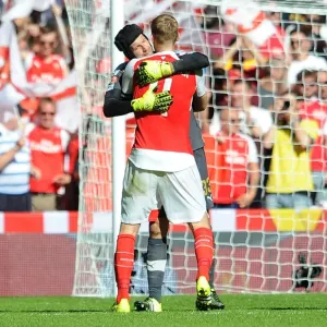 Arsenal's Unforgettable Embrace: Cech and Mertesacker Celebrate Community Shield Victory (2015-16) Arsenal's Unforgettable Embrace: Cech and Mertesacker Celebrate Community Shield Victory (2015-16)