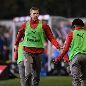 Arsenal's Unforgettable FA Cup Encounter: Per Mertesacker and Ainsley Maitland-Niles High-Five at Sutton United