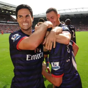 Arsenal FC Print: Mikel Arteta and Santi Cazorla Celebrate at Anfield Arsenal FC Print: Mikel Arteta and Santi Cazorla Celebrate at Anfield