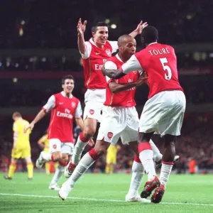 Arsenal's Unforgettable Triumph: Toure, Henry, and van Persie Celebrate a 3:0 Victory Over Liverpool