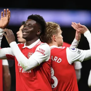 Arsenal's Unstoppable Duo: Martin Odegaard and Bukayo Saka Celebrate Goal Against Tottenham in the 2022-23 Premier League Arsenal's Unstoppable Duo: Martin Odegaard and Bukayo Saka Celebrate Goal Against Tottenham in the 2022-23 Premier League