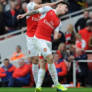 Arsenal's Unstoppable Duo: Bellerin and Gabriel Celebrate Their Third Goal Against Watford (April 2016)