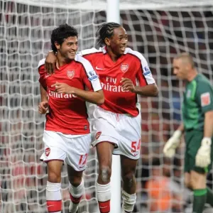 Arsenal's Unstoppable Duo: Carlos Vela and Sanchez Watt's 2-0 Goal Celebration vs. West Brom in Carling Cup Arsenal's Unstoppable Duo: Carlos Vela and Sanchez Watt's 2-0 Goal Celebration vs. West Brom in Carling Cup
