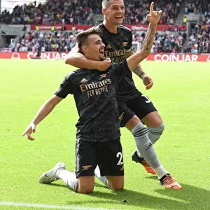 Arsenal's Unstoppable Duo: Fabio Vieira and Granit Xhaka Celebrate Their Third Goal Against Brentford (2022-23)