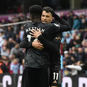 Arsenal's Unstoppable Duo: Martinelli and Nketiah Celebrate Four-Goal Lead Against Aston Villa (2022-23)