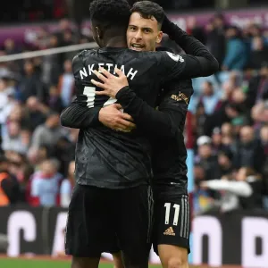 Arsenal's Unstoppable Duo: Martinelli and Nketiah Celebrate Four-Goal Lead Against Aston Villa (2022-23)
