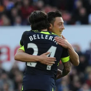 Arsenal's Unstoppable Duo: Ozil and Bellerin Celebrate Goal Against Stoke City