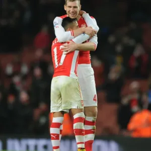 Arsenal's Unstoppable Duo: Sanchez and Mertesacker Celebrate Victory (2014-15)