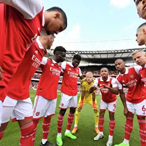 Arsenal's Unstoppable Force: The Huddle Before Battle Against Tottenham in the Premier League (2022-23)