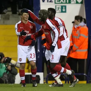 Arsenal's Unstoppable Moment: Kolo Toure, Bacary Sagna, and Andrey Arshavin Celebrate Goal Against West Bromwich Albion (3-1)