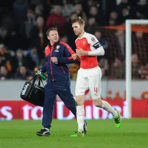 Arsenal's Unwavering Duo: Per Mertesacker and Colin Lewin during the FA Cup Fifth Round Replay vs Hull City Arsenal's Unwavering Duo: Per Mertesacker and Colin Lewin during the FA Cup Fifth Round Replay vs Hull City