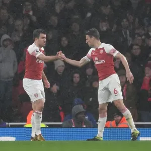 Arsenal's Unyielding Defensive Duo: Sokratis and Koscielny in Action against Manchester United (2018-19)